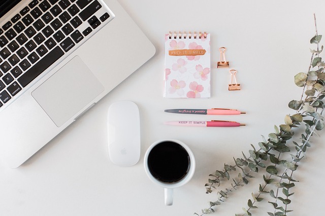 Writing workspace with notebooks pens and proofreading notes