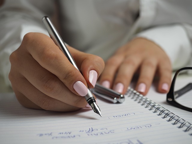 Fountain pen handwriting showing consistent letter formation on lined notebook