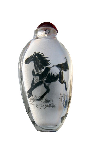 Ink bottle and calligraphy nib arranged on a desk